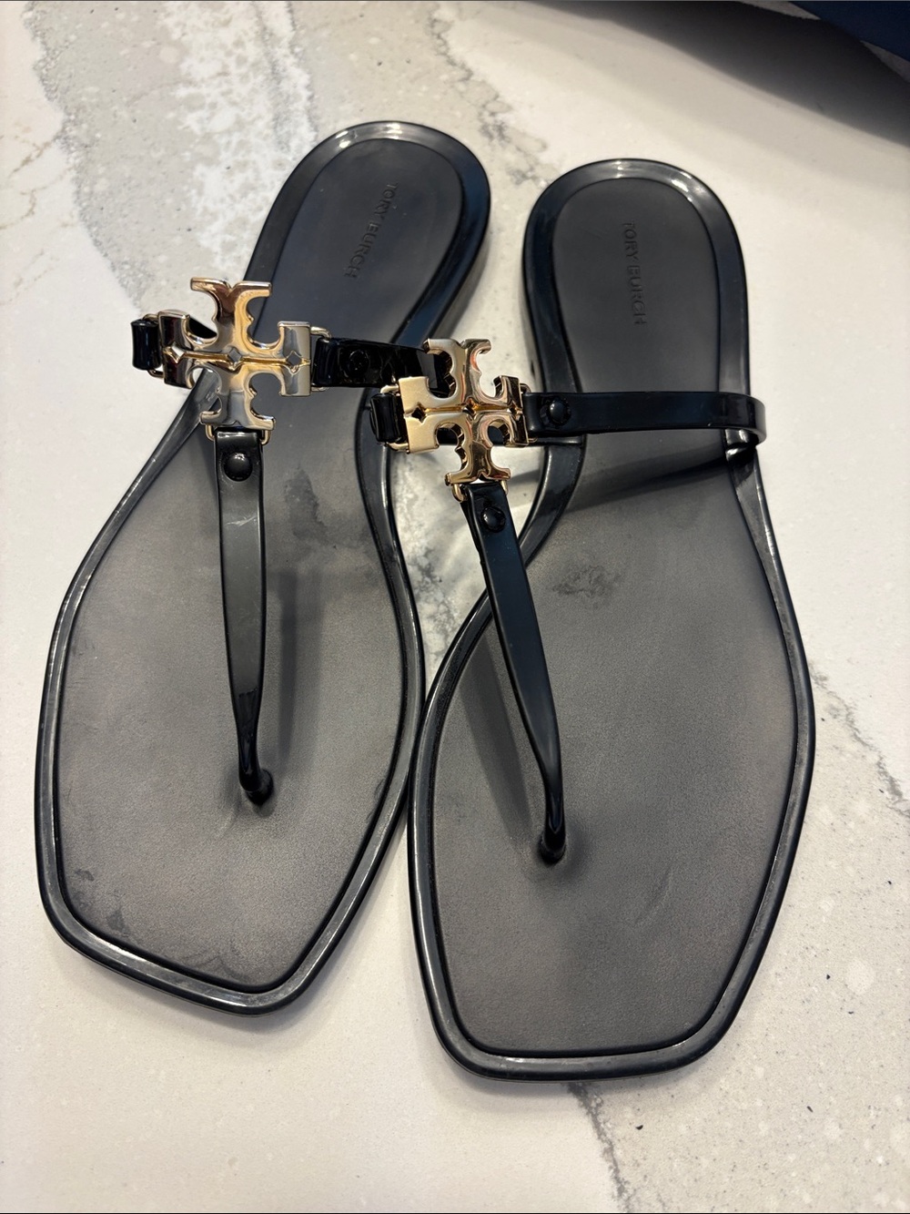 Tory Burch Black Jelly Thong Sandals with Gold Logo Emblem